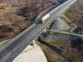 Aerial Top View of White Truck with Cargo Semi Trailer Moving on Royalty Free Stock Photo
