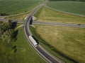 Aerial Top View of White Truck with Cargo Semi Trailer Moving on Royalty Free Stock Photo