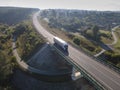 Aerial Top View of White Truck with Cargo Semi Trailer Moving on Royalty Free Stock Photo