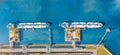 Aerial top view wide panorama of the oil terminal and two moored tankers with liquid fuel loaded on the pier, railway tank cars