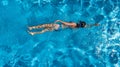 Aerial top view of woman in swimming pool water from above, tropical vacation concept Royalty Free Stock Photo