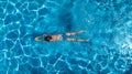 Aerial top view of woman in swimming pool water from above, tropical vacation Royalty Free Stock Photo