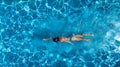 Aerial top view of woman in swimming pool water from above, tropical vacation Royalty Free Stock Photo