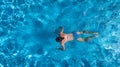 Aerial top view of woman in swimming pool water from above, tropical vacation holiday Royalty Free Stock Photo