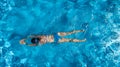 Aerial top view of woman in swimming pool water from above, tropical vacation holiday Royalty Free Stock Photo