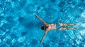 Aerial top view of woman in swimming pool water from above, tropical vacation holiday Royalty Free Stock Photo