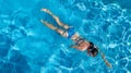 Aerial top view of woman in swimming pool water from above, tropical vacation holiday Royalty Free Stock Photo