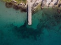 Aerial top view of a wooden dock over the shore in Medulin, Croatia Royalty Free Stock Photo