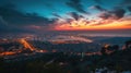 Aerial townscape top down view at sunset with skyline and street lights