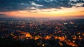 Aerial townscape top down view at sunset with skyline and street lights