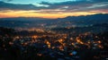 Aerial townscape top down view at sunset with skyline and street lights