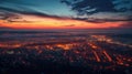 Aerial townscape top down view at sunset with skyline and street lights