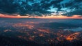 Aerial townscape top down view at sunset with skyline and street lights