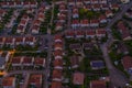 Aerial townscape view of residential houses and street at dusk