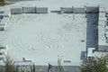 Traces on marble powder among carved marble blocks ready for spedition, Carrara, Italy