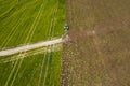 Aerial: The tractor harvester on the field