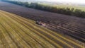 Aerial tractor plowing field