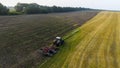 Aerial tractor plowing field