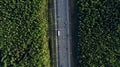 AERIAL. Traffic interchange. Top view of the road, city and forest. Summer video from the drone. Royalty Free Stock Photo