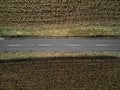 Aerial Tranquility: Straight Rural Road Amidst Dried Cornfields Royalty Free Stock Photo