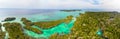 Aerial: tropical paradise pristine coast line rainforest blue lake at Bair Island. Indonesia Moluccas archipelago, Kei Islands, Royalty Free Stock Photo