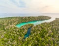 Aerial: tropical paradise pristine coast line rainforest blue lake at Bair Island. Indonesia Moluccas archipelago, Kei Islands, Royalty Free Stock Photo