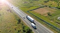 Aerial. Truck and other vehicles driving by the highway. View above