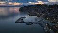 Aerial Twilight drone view of Ohrid City at Night in North Macedonia. Old Town on Ohrid lake with a beautiful fortress