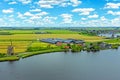 Aerial from a typical dutch landscape with windmills, water en far views