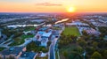 Aerial Urban Sunset Over Serpentine River and Green Spaces