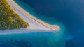 Aerial vertical drone view of Zlatni Rat cape on Brac island in Croatia. Magical and beautiful peninsula, famous on croatian coast Royalty Free Stock Photo