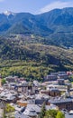 Aerial vertical of a picturesque Andorra la Vella cityscape with mountains and sky background