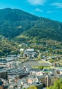 Aerial vertical of a picturesque Andorra la Vella cityscape with mountains and sky background