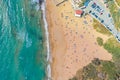 Aerial vew fying drone view of the beach with sunbathers resting people