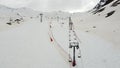 Aerial video between chairlifts of the ski resort of Formigal, Huesca, Spain without people