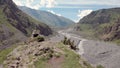 Aerial video of Dariali Gorge near Russia Georgian borders. Road goes through Caucasian mountains. Impressive view on Royalty Free Stock Photo