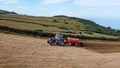 Aerial Video of Massey Ferguson 390T Tractor Abbey Tanker spreading manure in a field on a farm in UK Royalty Free Stock Photo