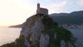 Aerial video. The Sveta Nedelja - Christian church on a tiny island in the sea close to the city of Petrovac Lots of