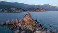 Aerial video. The Sveta Nedelja - Christian church on a tiny island in the sea close to the city of Petrovac Lots of