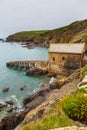 Aerial view of abandoned dock building, Lizard Point, Cornwall.