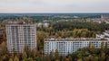 Aerial view of the abandoned ruined multi-storey buildings at the street block in Pripyat ghost town