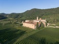 Aerial view of Abbazia di Praglia Italian Benedictine monastery in green vineyard hill landscape Royalty Free Stock Photo