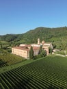 Aerial view of Abbazia di Praglia Italian Benedictine monastery in green vineyard hill landscape Royalty Free Stock Photo