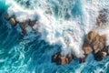 Aerial view from above down the seashore. The waves crash on the rock