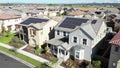 Aerial view above houses, solar project renewable energy panels on neighborhood