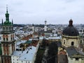 Aerial view from above of Lviv city, Ukraine. Beautiful drone photography. Town Hall tower and cathedral church, city centre