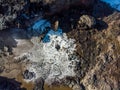 Aerial view from above at a Nakalele blowhole after water eruption, Maui, Hawaii. Royalty Free Stock Photo