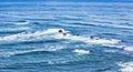 Aerial view from above of ocean, rocks and water waves in Pacific ocean. Royalty Free Stock Photo