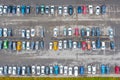 Aerial view from above of the parking lot with cars in the business district of the city, wet asphalt Royalty Free Stock Photo