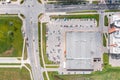 Aerial view of parking lot with many cars near shopping center Royalty Free Stock Photo